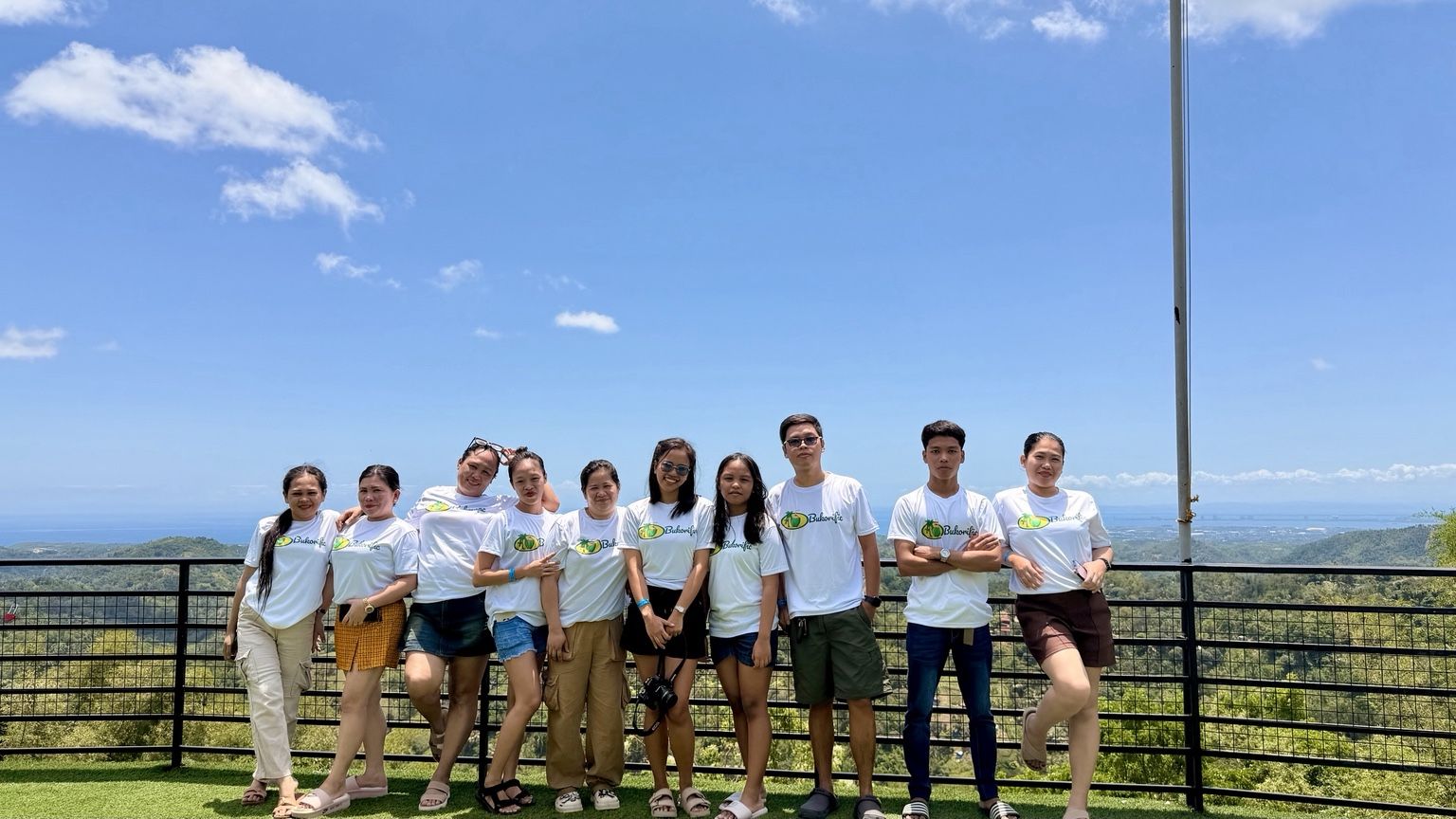 Bukorific team standing together and facing the camera at a Cebu mountain lookout